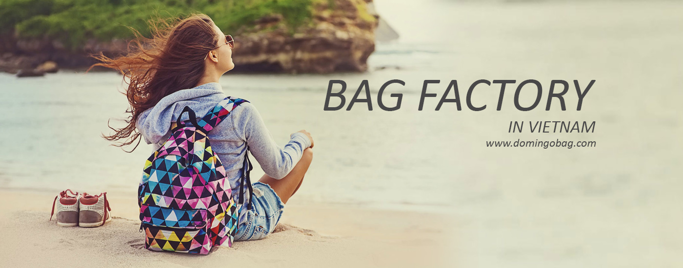 Girl wears backpack in the beach
